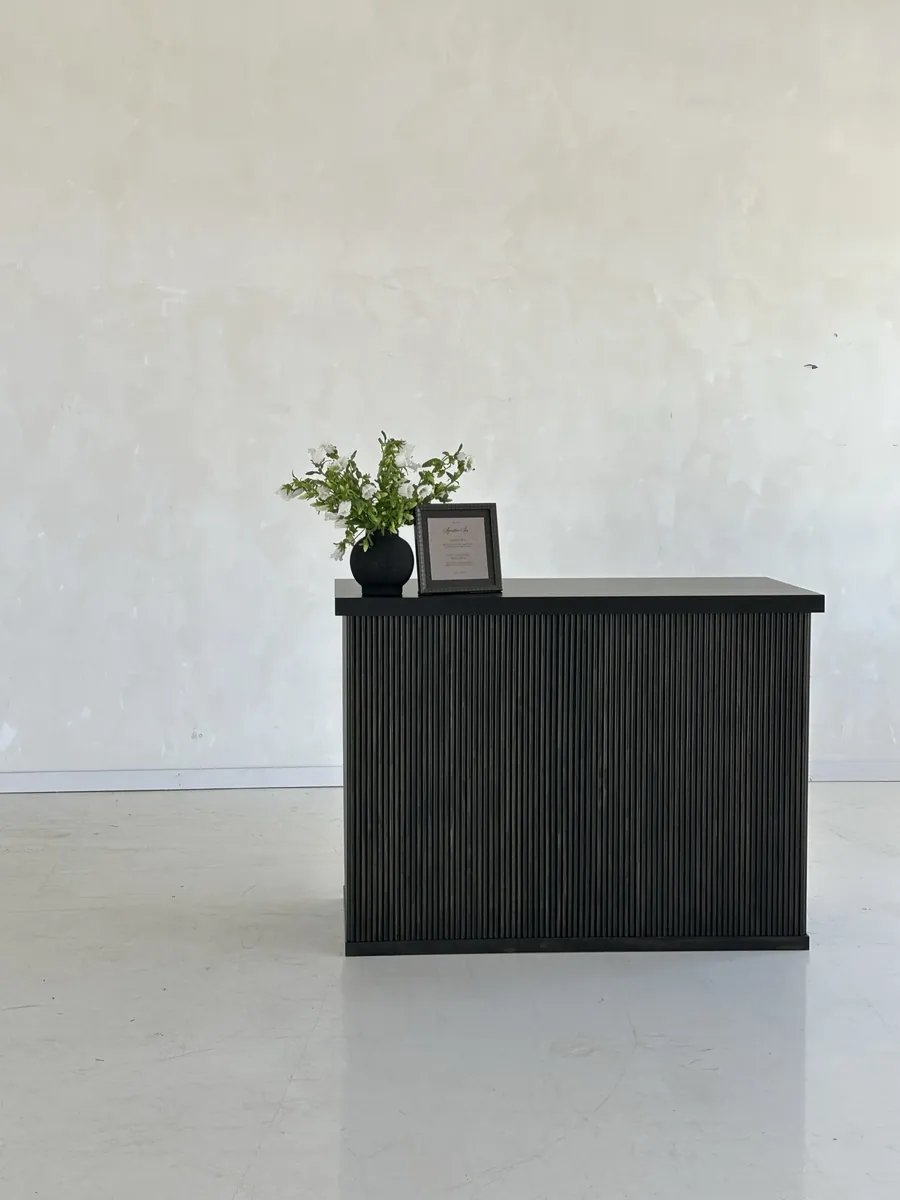 A RidgeCraft bar with a fluted front painted black