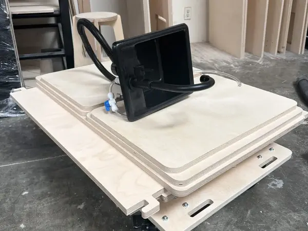 Birch panels stacked flat on a dolly with the sink on top, ready to ship