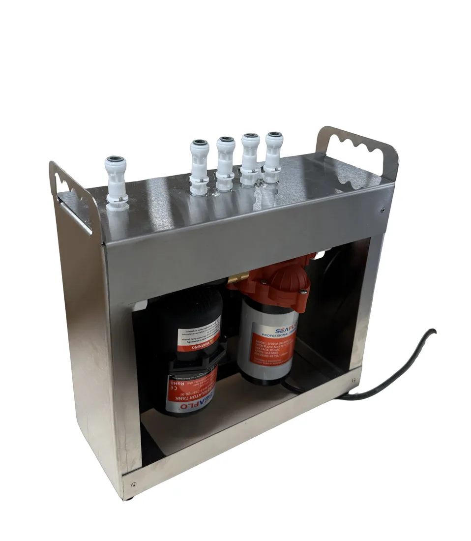 The Backbone pump and accumulator inside its brushed stainless enclosure, with four valved quick-connect outlets on top