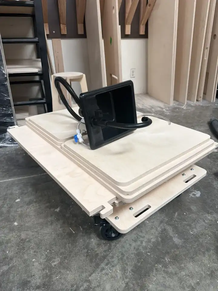 The Pack Flat cart panels packed flat on a dolly, the sink on top, ready to ship